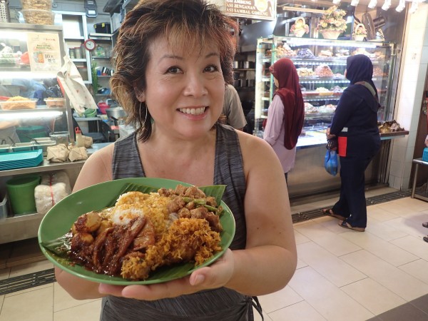 Melissa Chang and her plate of Malay food.