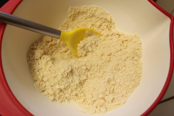 Once you add the flour to the butter and sugar mixture, the dough will get crumbly like this.