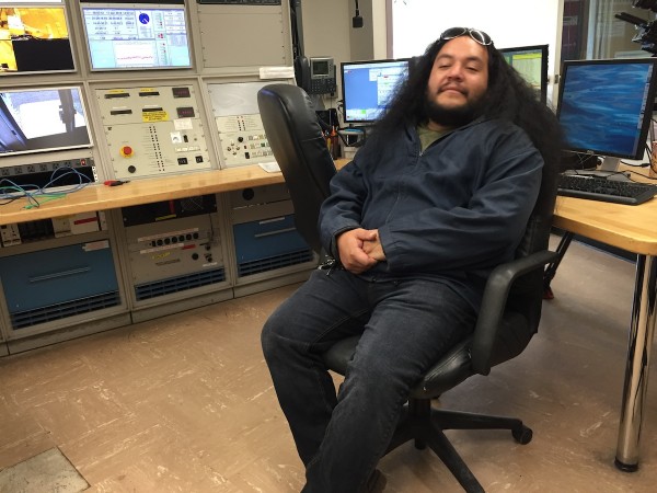 Kumu hula and our cultural guide Micah Kamohoali‘i, taking a break in the control room at the Gemini Observatory.